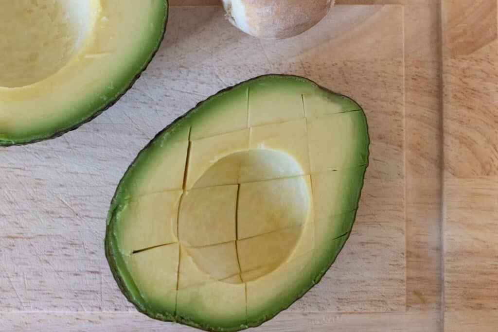 Avocado sliced to half and crosswise.