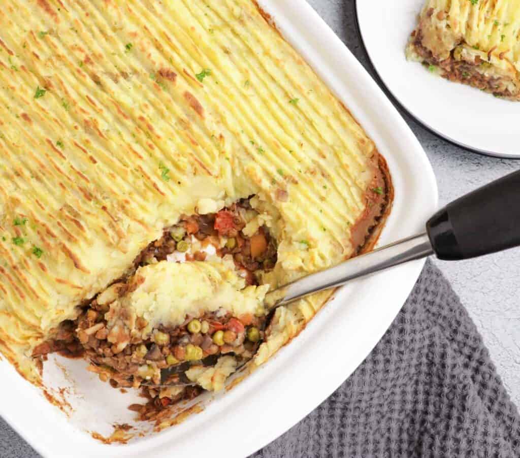 Fluffy mashed potatoes and flavorful filling for a vegan lentil shepherd's pie.