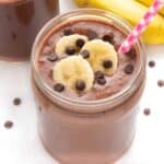 Creamy chocolate banana smoothie with a straw