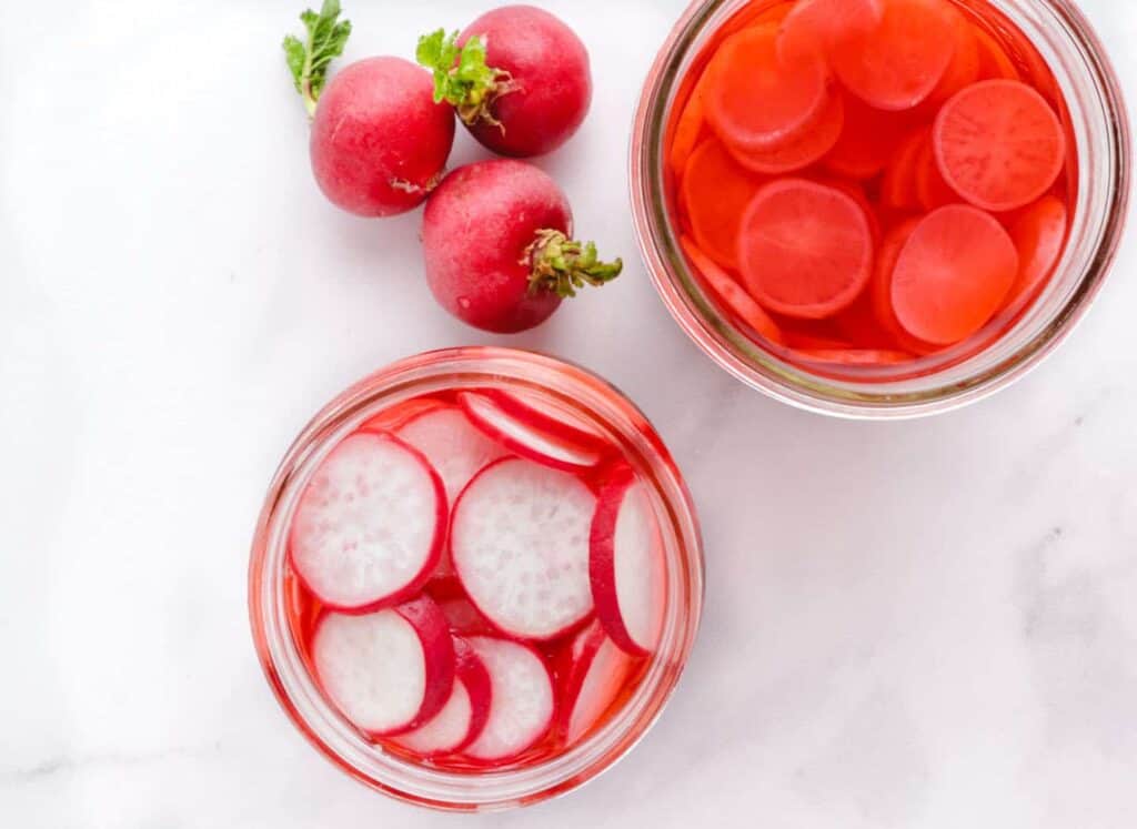 two jars of quick pickled radishes