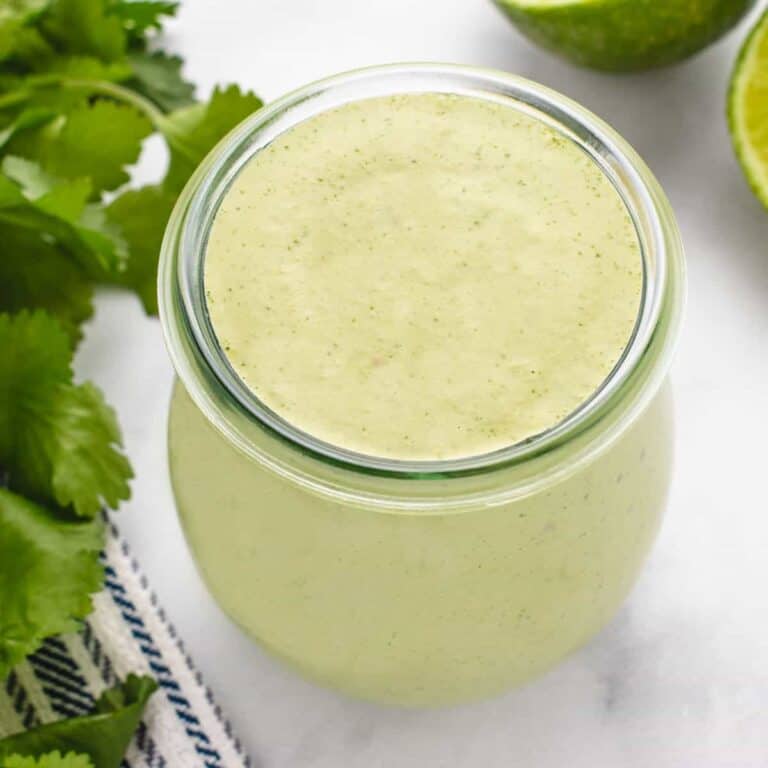 Cilantro cashew dressing in a glass jar.