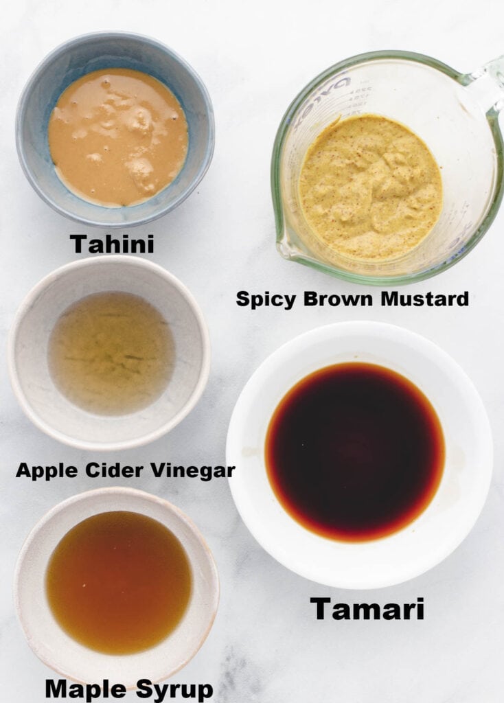 Ingredients for vegan mustad sauce in individual bowls.