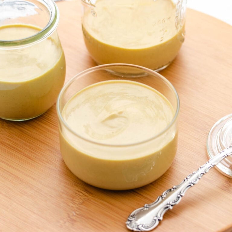 Vegan honey mustard in a glass bowl.