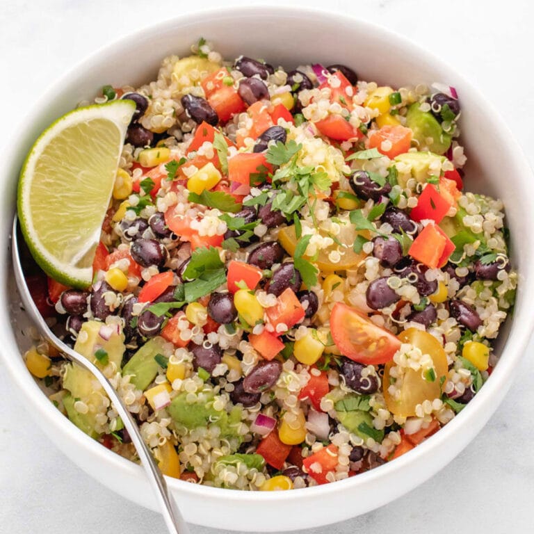 Zesty quinoa salad with black beans, tomatoes, and cilantro.