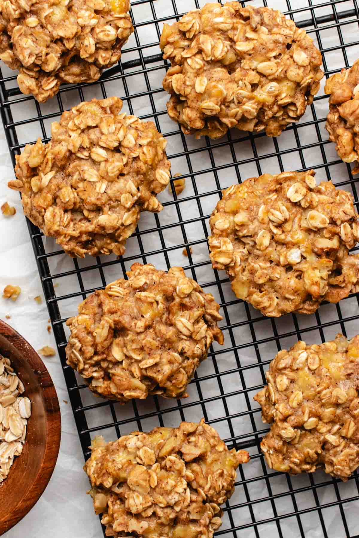 Vegan oat banana cookies on a black cooling rack.